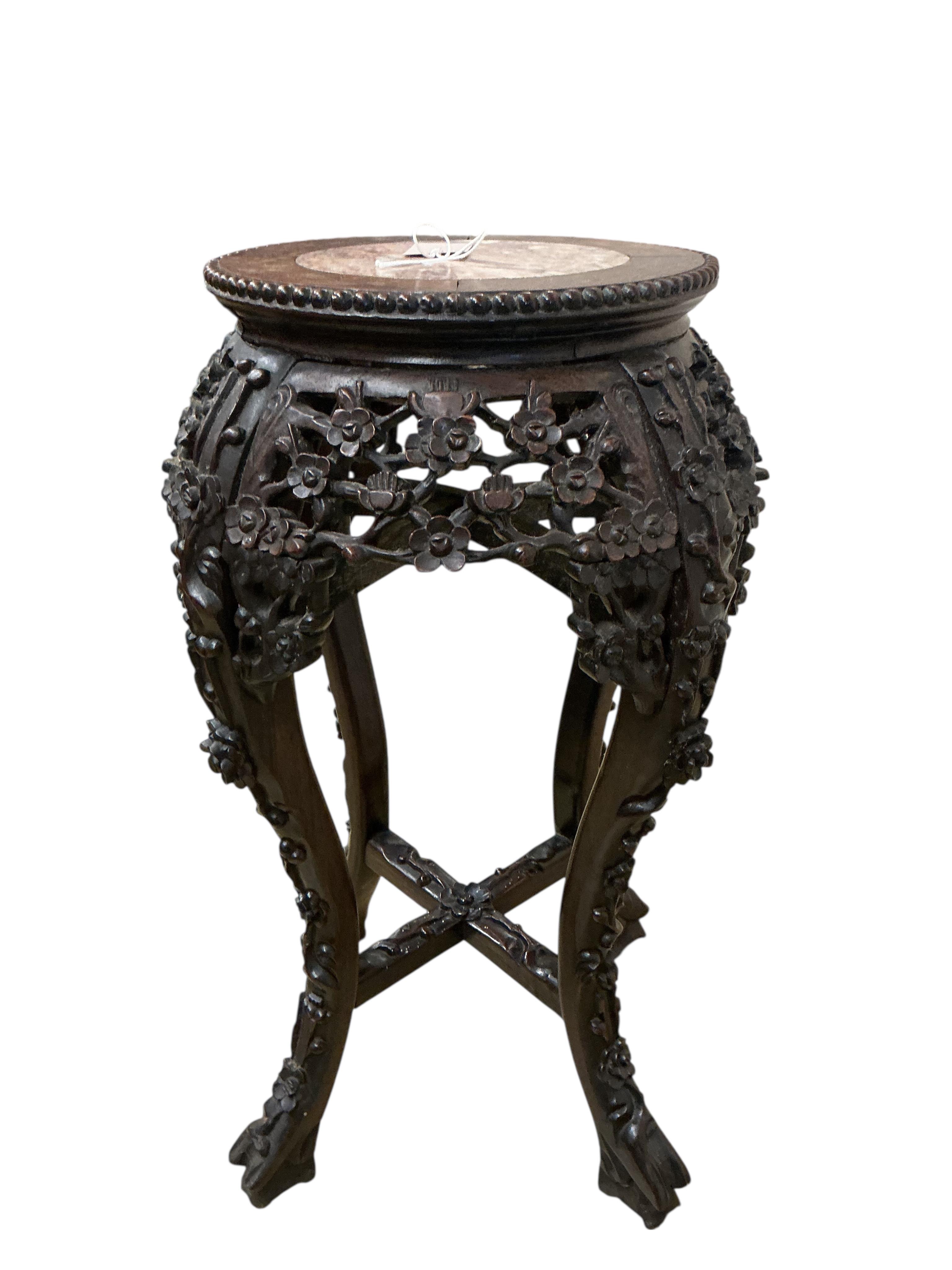 A Chinese mother of pearl inlaid rouge marble topped carved hardwood jardiniere stand, height 60cm